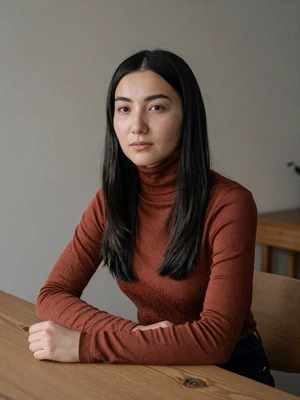 Nurzat, 27, Kyrgyzstan - Graphic designer who blends traditional Kyrgyz patterns into modern art. Loves poetry from the Manas epic and exploring mountain trails.