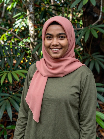 Rosmah, 24, Brunei - Eco-tourism guide in Brunei's pristine rainforest. Adventurous yet deeply grounded in Malay traditions and Islamic values.